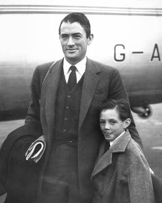 Dec. 11, 1953 - London, England, U.K. - Actor GREGORY PECK (1916-2003) was born in La Jolla, California. Pictured with his son JONATHAN as they arrive in London. London United Kingdom  - ZUMAk09