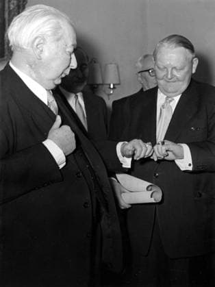 Apr. 5, 1954 - Bonn, Germany - As Germany s minister of economic affairs from 1949 to 1963, LUDWIG ERHARD crafted the plan for West Germany s post-World War II economic recovery, sometimes called the German economic miracle. In 1957 he was named vice chancellor, and in 1963 he succeeded Konrad Adenauer as chancellor. PICTURED: German President THEODOR HEUSS and LUDWIG ERHARD during a gala of Zentralverband des Deutschen Handwerks. Bonn Germany  - ZUMAk09