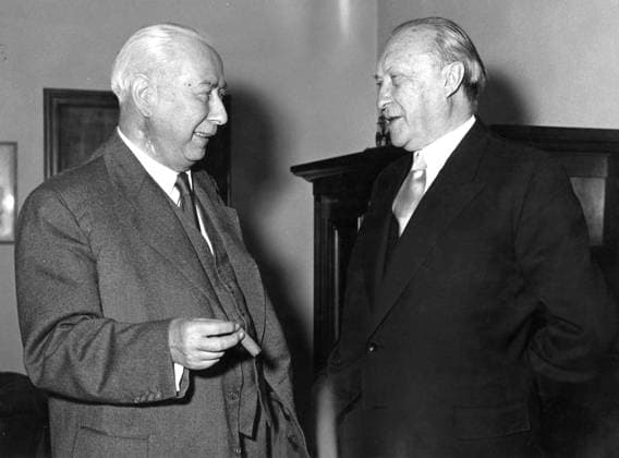 June 6, 1955 - Bonn, Germany - West Germany s first chancellor KONRAD ADENAUER began his career in politics as a member of the Cologne City Council, becoming lord mayor of the city. After the Nazis came to power in 1933, Adenauer, who had not hidden distaste for them, lost his positions, was forced to go into exile for a year in an abbey and was later interned in a prison camp. Adenauer was elected Chancellor of the Federal Republic of Germany on 15 September 1949. His main aim was to ensure West Germany s transition to a sovereign, democratic state. He held power for the next fourteen years and during that time played an important role in restoring good relations with France and the United States. PICTURED: President Prof. THEODOR HEUSS came to Bonn from a talk with Henry Kissinger. The picture shows President Heuss back in Bonn with Dr. ADENAUER during a long meeting they had togethe  - ZUMAk09