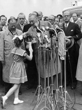 Sep. 14, 1955 - Bonn, Germany - West Germany s first chancellor KONRAD ADENAUER began his career in politics as a member of the Cologne City Council, becoming lord mayor of the city. After the Nazis came to power in 1933, Adenauer, who had not hidden distaste for them, lost his positions, was forced to go into exile for a year in an abbey and was later interned in a prison camp. Adenauer was elected Chancellor of the Federal Republic of Germany on 15 September 1949. His main aim was to ensure West Germany s transition to a sovereign, democratic state. He held power for the next fourteen years and during that time played an important role in restoring good relations with France and the United States. PICTURED: KONRAD ADENAUER giving a speech at Cologne airport after his come back from Moscow. He was greeted by the German Delegation after his arrival from Moscow in the Cologne Bonn airpo  - ZUMAk09