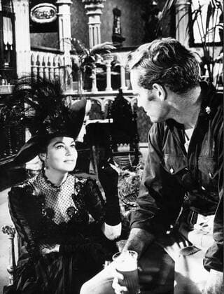 Sep. 28, 1961 - Paris, France - Actor CHARLTON HESTON known for his religious roles in Ben-Hur and The Ten Commandments , pictured with AVA GARDNER on the set of, 55 Days at Peking . Paris France  - ZUMAk09