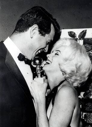IMAGO ICONS: Marilyn Monroe Mar. 13, 1962 - Los Angeles, CA, U.S. - Actress MARILYN MONROE after receiving The Golden Globe Award sharing her happy moment with ROCK HUDSON, who just passed her the award. Most endlessly talked-about and mythologized figure in Hollywood history, Marilyn remains the ultimate superstar. Impossibly alluring, she defined the very essence of screen sexuality and the camera adored her. Los Angeles United States of America  - ZUMAk09