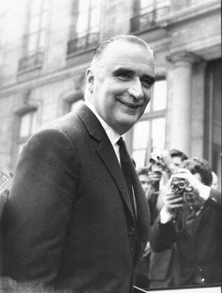 Oct. 6, 1962 - Paris, France - President of the French Republic GEORGES POMPIDOU is greeted by photographers as he arrives at his official residence Elysee Palace. Paris France  - ZUMAk09