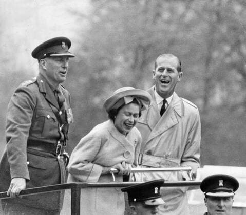 May 11, 1963 - Cwrt-y-Gollen, Wales, U.K. - The elder daughter of King George VI and Queen Elizabeth, ELIZABETH WINDSOR (named Elizabeth II) became Queen at the age of 25, and has reigned through more than five decades of enormous social change and development. PICTURED: QUEEN ELIZABETH and PRINCE PHILIP watching a funny presentation by recruits of Welsh Brigade. Cwrt-y-Gollen United Kingdom  - ZUMAk09