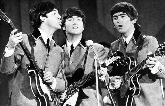 Aug. 7, 1963 - London, England, U.K. - THE BEATLES in action (from L-R) PAUL McCARTNEY, JOHN LENNON and GEORGE HARRISON. Picture taken during their recent visit to the States. London United Kingdom  - ZUMAk09