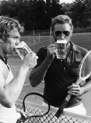 Aug. 21, 1965 - Munich, Germany - Actor CHARLTON HESTON known for his religious roles in Ben-Hur and The Ten Commandments , pictured with SEPP MAIER as they have a beer after a tennis match. Munich Germany  - ZUMAk09