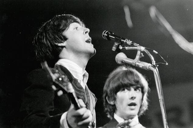 June 24, 1966 - Munich, Germany - The Beatles perform at their first concert in Munich for Circus Krone Bau . PICTURED: PAUL MCCARTNEY and GEORGE HARRISON on stage during the concert. Munich Germany  - ZUMAk09