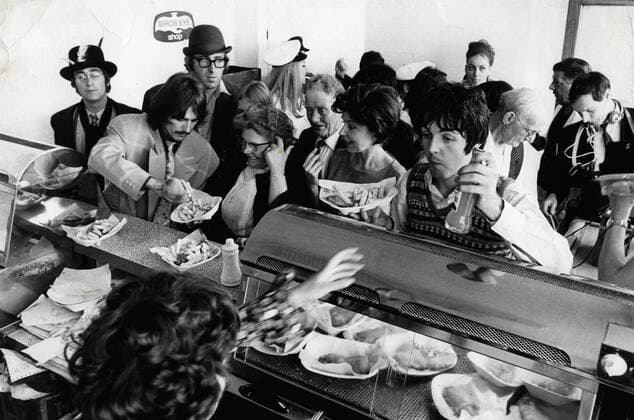 Oct. 17, 1967 - London, England, U.K. - The Beatles (LtoR) JOHN LENNON, GEORGE HARRISON and PAUL MCCARTNEY ordering some food in a public Fish and Chips shop while filming thier TV show Magical Mystery Tour. London UK  - ZUMAk09