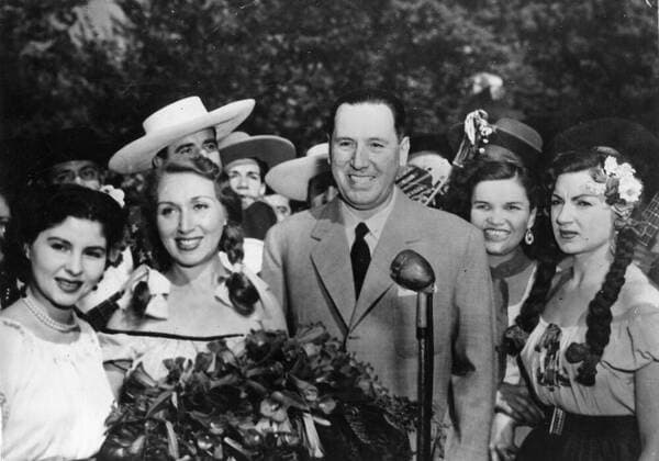 March 2, 1953 - Santiago, Chile - President of Argentina JUAN DOMINGO PERON surrounded by a group of Huasos ladies (Chilean Gauchos) who serenaded him upon arrival to Chile. Santiago Chile  - ZUMAk09