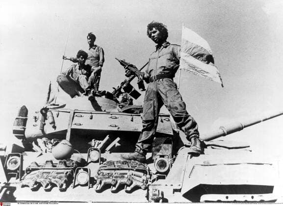 Oct 01, 1973 - Golan Heights, Israel - Also known as the Fourth Arab-Israeli War, Yom Kippur War was fought from October 6 to October 26, 1973 by a coalition of Arab states led by Egypt and Syria against Israel. The war began with a surprise joint attack by Egypt and Syria on the Jewish holiday of Yom Kippur. Egypt and Syria crossed the cease-fire lines in the Sinai and Golan Heights, respectively, which had been captured by Israel in 1967 during the Six-Day War. Many Arab states contributed troops and financial support, and the USSR also provided assistance but ultimately the Arabs buckled under a sustained Israeli counter-attack strengthened by US airlifts. PICTURED: An Israeli soldier on a tank. Golan Heights Israel  - ZUMAk09