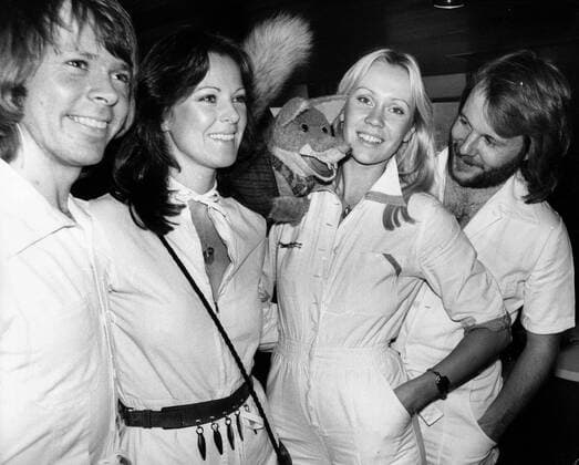 Nov 15, 1976; London, UK; The successful Swedish pop group ABBA, who won the Eurovision contest with Waterloo and have since sold almost million singles and staggering twelve million LP s, are currently in London to promote their new album Arrival. The picture shows BJORN ULVAEUS, FRIDA LYNGSTAD, ANNA FALTSKOG and BENNY ANDERSON being greeted by BASIL BRUSH, the tv puppet on board the Mayflower Garden, when they took a trip the Thames after their arrival in London. . London UK  - ZUMAk09