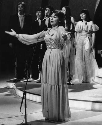 May 8, 1977 - London, England, U.K. - Singer MARIE MYRIAM singing her winning song, The Bird and the Child, at the Eurovision Song Contest at the Wembley Conference Center. London United Kingdom  - ZUMAk09