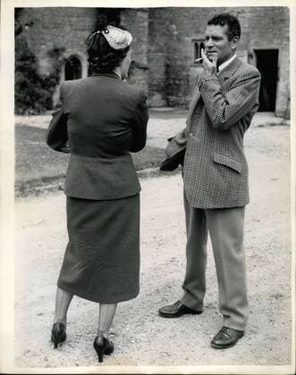 Jul. 07, 1953 - Sir Laurence Olivier Robber: Notley Abbey, Buck nghemshire, Vivien Leigh was robbed early yesterday. Thieves carried a ladder from the Abbey barn and used at to climb into the Oliviers bedroom window - and stole furs and jewellery valued at about ?5,000 Vivian Liegh, who has been making good progress after her breakdown in March - is suffering from shock as result of the robbery - and spent yesterday in bed. Photo shows Sir Laurence Clivier chats to a reporter in the grounds of Netley Abbey after the robbery yesterday.  - ZUMAk09
