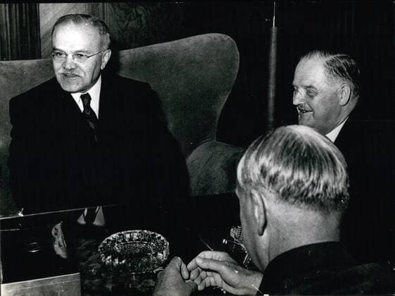 May 05, 1955 - To sign the Austrian State Treaty: The Foreign minister of Soviet Russia, Wjatscheslaw Moletow, arrived in Vienna. Shortly after his arrival he paid a visit to the Austrian Chancellor Dr. Julius Raab. The two politicians had a very friendly conversation. Photo Shows The Russian Minister Molotow (left) and Chancellor Raab (right) and Vice-Chancellor Dr. Adolf Scharf.  - ZUMAk09