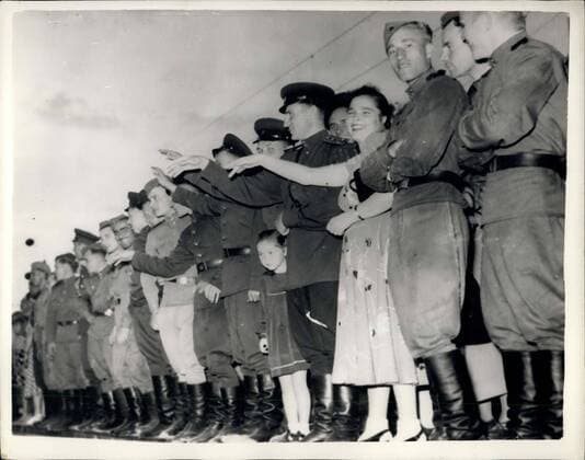 Aug. 25, 1955 - Soviet troops leave Austria: The main body of Soviet infantry and tank units at the St. Poelten area, in Lower Austria, left the town on Tuesday. Many commandered buildings were put to Austrian use and others will be cleared by the occupation authority soon. Only small contingent of Soviet troops remained at St. Poelten. Photo Shows Soviet troops who remained at St. Poelten wave goodbye to their departing comrades.  - ZUMAk09