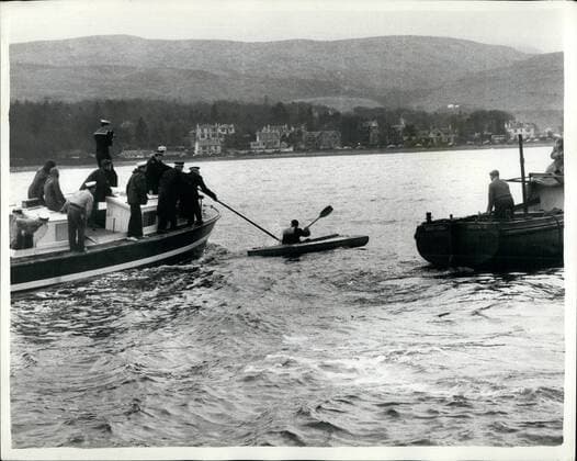 Mar. 03, 1961 - Kayak Commandos Try To Delay Mooring Of United States Submarine Depot Ship Proteus - In Holy Loch: The United States Submarine a Depot Ship Proteus arrived in the Holy Loch this morning and young demonstrators - against the Polaris base in Britain in Kayaka - tried to delay the mooring of the vessel. Their Kayak capsized - and the demonstrators had to be fished from the water. Photo shows Civilian police aboard a motor launch - seize one of the Kayak demonstrators - in the Holy Loch this morning.  - ZUMAk09