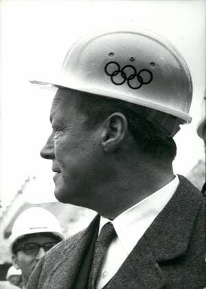 Mar. 03, 1970 - Willy Brandt..: The Chancellor of the federal Republic of Germany arrived in the Olympic Town of 1972, Munich. Together with the federal Minister for foreign Affairs, Walter Scheel, he took part in the constituting conference of the advisory board of the National Olympic Commiittee. During this meeting he was elected the first Chairman. The Federal Chancellor pointed out that the Olympic Games 19792 in Munich will not be, of course, a Bavarian affair, but a sporting event of the whole German nation. Picture Shows: Willy Brandt with protecting helmit showing the Olympic amblems.  - ZUMAk09