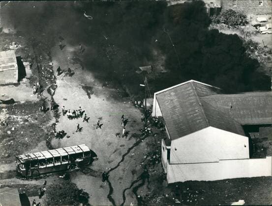 Jun. 06, 1976 - 100 People Killed And More Than 1,000 Injured In South Africa s Worst Outbreak Of Civil Unrest : The Wrest outbreak of civil unrest in South Africa has claimed the lives of 100 people, and more than 1,000 have been injured in rioting at Soweto, the African township outside Johannesburg. The rioting began during a March by black students against the use of African s in lessons. Police opened fine and cars and buildings were set on fire. Photo Shows A beer hall in set on fire by the rioters in Soweto on the left is a burnt-out bus.  - ZUMAk09