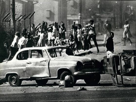 Jun. 06, 1976 - 100 People Die And More Than 1,000 Injured In South Africa s Worst Riots In Soweto: The worst outbreak of civil unrest in South Africa has claimed the lives of 100 people, and more than 1,000 have been injured in rioting at Soweto, the African township outside Johannesburg. The rioting began during a march by black students protesting against the use of Afrikaans in lessons. Police opened fire and cars and building were act on fire. Photo shows Some of the rioters use cars as roadblocks during the riots in Soweto.  - ZUMAk09