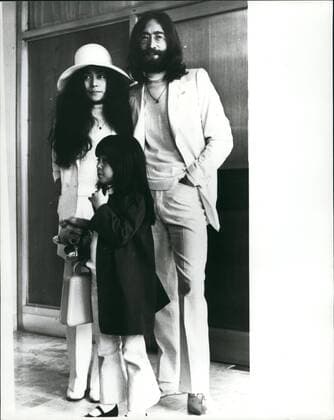 Dec. 12, 1980 - John Lennon Shot Dead: Former Beatles John Lennon was shot dead at his apartment in New York City Last Night. Photo Shows John Lennon and his wife Yoko Ono with her daughter by her previous marriage Yoko Pictured at London Airport in May 1969 leaving for his ~ to stage a seven day Bed-in- for-peas . This was their second Bed-in their first was held a month previously in Amsterdam. Lennon chose the Be hams as the nearest British settlement to the U.s. -he had been refused a U.s. visa because of a drug conviction.  - ZUMAk09