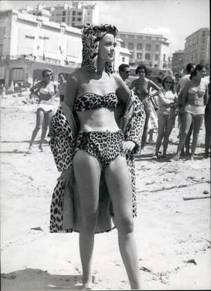 Aug. 08, 1959 - London Models take part in &pound;250,000 British Fashion show in Biarritz: Members of the International society gathered in Bearritz this week end when six leading London models displayed fur fashions in &pound;250,000 gala fashion show. The Duke and Duchess of Windsor, and many famous personalities attended. Photo shows Nena Dubios, one of the models, who took part in the fashion show, causes a sensation when she went to the beach at Biarritz clad in this leopard skin bikini coat and hat to match.  - ZUMAk09