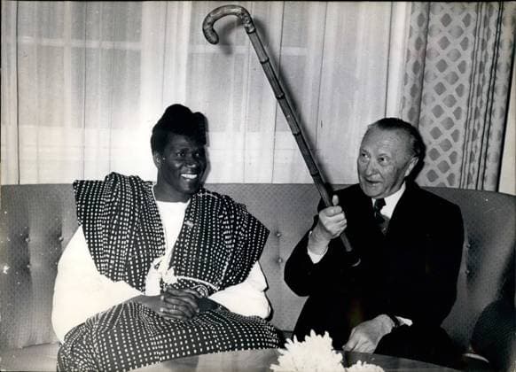Nov. 11, 1959 - Sekou Toure with Chancellor Dr. Adenauer: On Nov. 16th, 1959, State President Sekou Toure of Guinea arrived in Bonn. The programme of his visit also includes inspection of the Hoesch furnace site and the chemical works Hoechst. OPS: Sekou Toure (SEKOU TOURE) together with Chancellor Dr. Konrad Adenauer who is threatening the photographers who are perhaps a little too persistent, with his walking stick.  - ZUMAk09