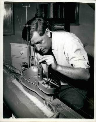 Nov. 11, 1959 - TEN FOOT WORKING MODEL OP A SUBMARINE BUILT5 NOV 1959 IN A BEDROOM, .IT WILL ACTUALLY FIRE REAL MISSILES A ten foot long model of a apbmsrine has been built in the attic bedroom of a 38 year old Ministry of Supply worker Ã¢â‚¬âÄ MR. DAVID ASHTON of Sewenosks, !Cent, et a cost of &pound;1,000., Named Olympus it will be capable of fitting missiles and torpedoes while submerged Ã¢â‚¬âÄ being operated by remote control. The model was started three year. ago Ã¢â‚¬âÄ weighs 200 lb and is capable of diving to 15 feet.. It will be fitted with navigational lights end Aldis lamps which will wink out moue signals Ã¢â‚¬âÄ and Mr. Ashton hopes to navigate it from Westminster to Calais in a few months time_ An underwater movieÃ¢â‚¬âÄcamera can be fitted to the deck to film ite course. The mieseles will be the equivalent of the American Polaris rockets with a range of 300 yards.  - ZUMAk09