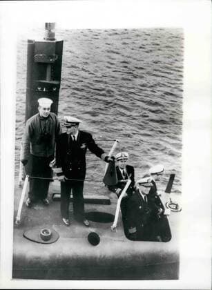 Mar. 03, 1961 - POLARIS SUBMARINE PATRICK HENRY ARRIVES IN HOLY LOCH: The 6700-ton American Polaris submarine Patrick Henry arrived in the Holy Loch, Firth of Clyde, today, and tied up alongside the submarine depot ship Proteus . Photo shows the Commanding Officer of the Patrick Henry directs the mooring of the submarine to the depot ship Proteus in the Holy Loch today.  - ZUMAk09