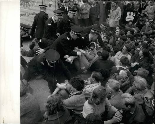 May 05, 1961 - Police Remove Demonstrators From Polaris Base.. Police struggled to remove demonstrators who squatted in the roadway - on the pier etc.. at the Nuclear Weapons - against the American Polaris Submarine now stationed in the Loch.. Keystone Photo Shows:- Police seen as they bodily remove some of the squatters - around the Holy Loch.  - ZUMAk09