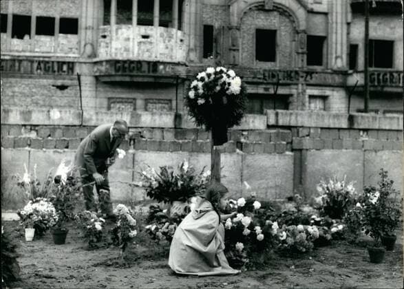 Aug. 08, 1962 - Another Murder at the Wall. During an attempt by 18 year old East Berlin resident Peter Fechter to scale the wall and flee into West Berlin, he was shot by the VOPO and killed. West Berlin policemen were powerless to help as he died on the East Berlin sid  - ZUMAk09