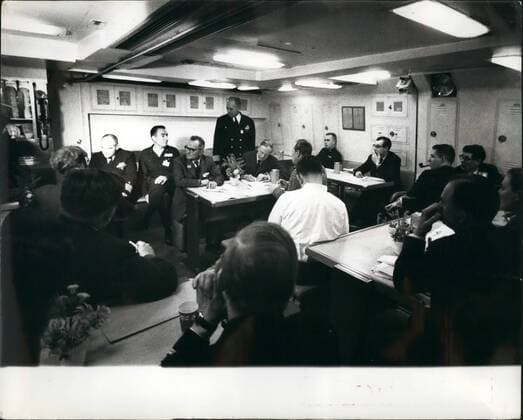 Jan. 01, 1963 - British Pressmen visit U.S.Polaris submarine press conference beneath the ocean.: A number of British Pressmen yesterday visited the United States Polaris submarine - Ethan Allen moored near the Holy Loch - Scotland - and was taken on a trip to sea i the &pound;50,000,000 craft. The submarine is said to carry more destructive power than that unleashed by both sides during the whole of the last war. Photo shows General view during the press Conference aboard the USS Ethan Allen as (left - right: - Capt. Lacy (Commander of the submarine) and Captain bell (standing) who is commender of No. 14 Submarine Squadron - talk to members of the press some hundreds of feet beneath the surface off the coast of Scotland.  - ZUMAk09