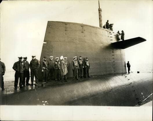 Mar. 03, 1963 - British press men visit U.S. Polaris Submarine. Ship s crew beneath the control tower.: A number of British pressmen yesterday visited the United States Polaris submarine - Ethan Allen moored near the Holy Loch - Scotland - and were taken on a trip to sea in the &pound;50,000,000 craft. The submarine is said to carry more destructive power than that unleashed by both sides during the whole of the last war. Photo shows some of the ship s crew mustered beneath the control tower of the USS Ethen Allen off the coast of Scotland. Above the tower is the complex radar scanner.  - ZUMAk09