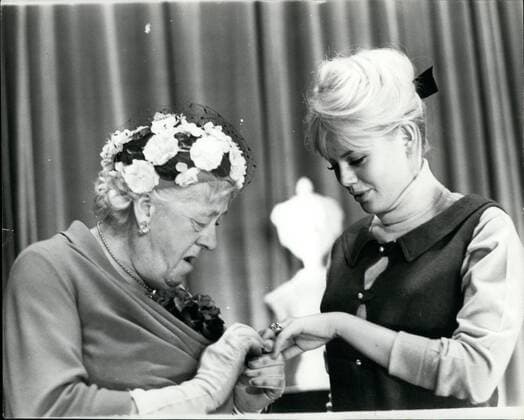 Feb. 02, 1964 - Margaret Rutherford sees the new wedding ring.: there was a lonely girl among the stars attending yesterday s rehearsal of the Royal Film Performance comedy Move over darling . She was the new Mrs. Peter Sellers - Swedish actress Britt Eklund, and she was lonely because Peter. who she married last week, has had to go to Hollywood to make a Film. Photo shows Veteran actress Margaret Rutherford, who appears in the film, look at the weeding and engagement rings of Britt Eklund.  - ZUMAk09