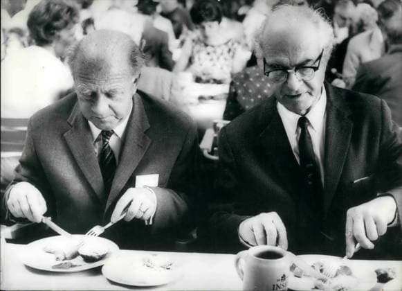Jun. 06, 1964 - Pictured here are Professors Heisenberg(left) and Linus Pauling at a Nobel Prize Winners Convention in Lindau Bodensee. As you can see they have a voracious appetite and are eating a traditional Bavarian meal. The 14th Convention is taking place between  - ZUMAk09