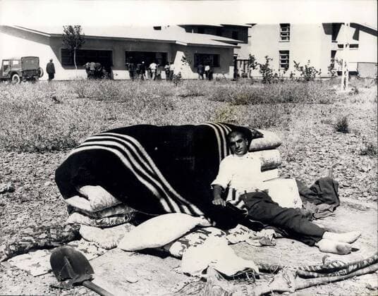 Aug. 25, 1966 - Earthquake Scenes in Turkey. A man sits with his belongings after the earthquake in Easter Turkey last Friday, which struck the provinces of Erzurum, Mus, Bingol and Bitlis killing 2300 people and rendering 70,000 homeless.  - ZUMAk09