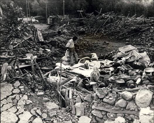 Aug. 25, 1966 - Earthquake scens in Turkey.: Original pictures just received, show scenes from Varto, which took the full force of the earthquake which struck provinces in Eastern Turkey last Friday, which killed more than 2,300 people and rendered 70,000 homeless. Photo shows this was the centre of Varto. Nothing remains but rubble - the destruction has been overwhelming. Our picture shows a family who spent the night amidst the rubble of their former home. A new day is about to break; another day of horror and misery.  - ZUMAk09