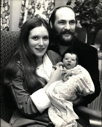 Nov. 11, 1971 - A son for Moody Blue Mike Pinder and His wife.; Donna, 20-year-old American born wife of Moody Blues members Mike Pinder gave birth to their first child, a son at St. Teresa s Hospital, Wimbledon on Tuesday (Nov23). The baby, who weighed 8lb 4 oz, is to be named Daniel Elan. The couple met in the U.S. and married last year in Epsom. They live in Cobham, Surrey. Mike Pinder plays mellotron, writes and sings with the Moddy Blues, one of the world s top bands. It is interesting that the Moddy Blues most recent LP, which has topped charts all round the world, is titled Every Good Boy Deserves Favour . Photo shows Mike Pinder and his wife, Donna, pictured with their baby son at St. Teresa s Hospital today.  - ZUMAk09