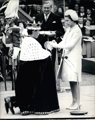 Feb. 26, 2012 - Royal Investiture: In Caernarvon Castle, Wales, this afternoon, H.R.H. Prince Charles was invested as The Prince of Wales by his mother H.M. Queen Elizabeth II. Photo shows H.M. Queen Elizabeth clasps Prince Charle s hands during the ceremony at Caernarvon Castle this afternoon.  - ZUMAk09