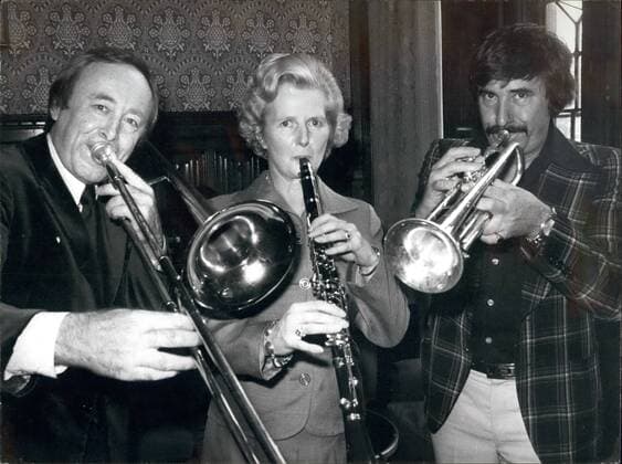 MRS MARGARET THATCHER JOINS IN WITH THE JAZZMEN: There was perfect harmony in the House of Commons when Mrs Thatcher, on clarinet, joined jazz musicians CHRIS BARBER, and KENNY BALL in a Dixieland session. When the music stopped, they discussed a jazz concert to be held at Albert Hall on Oct 25th organised by the Fulham and Hammersmith Conservative Association to help raise funds.  - ZUMAk09
