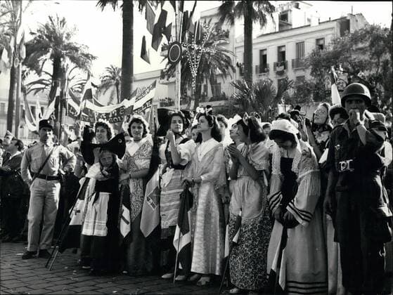 Apr. 18, 2012 - General De Gaulle in Algeria Photo shows young girls from French provinces wearing national dress, acclaim General De Gaulle.  - ZUMAk09