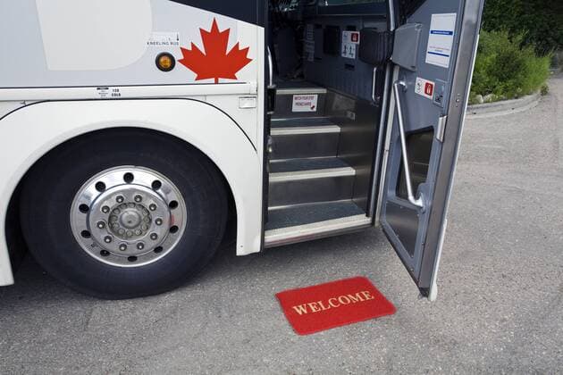 Greyhound bus with open door and welcome mat, Canada.  acp74611 Photography