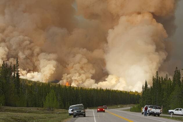 Road crews fighting a forest fire burning off the David Thompson Highway in Alberta, Canada  acp51230 photography