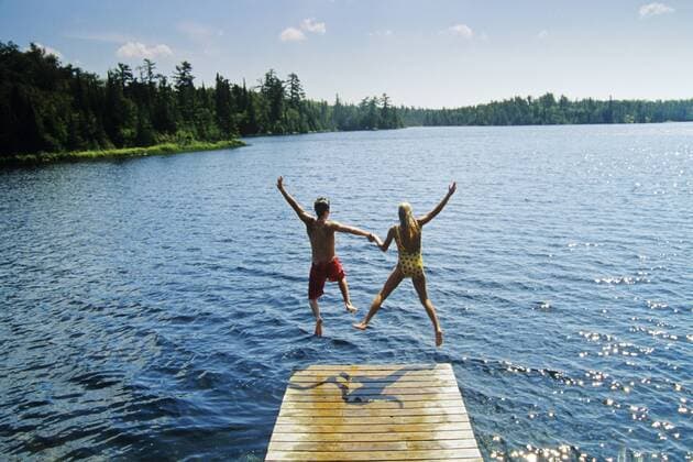 Jumping off dock, Lyons Lake, Whiteshell Provincial Park, Manitoba, Canada.  acp12021 DavexReede