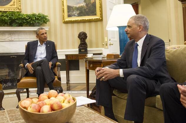 President Barack Obama meets with Attorney General Eric Holder on the ongoing violence in Ferguson, Missouri, at the White House on August 18, 2014 in Washington, D.C. Missouri Gov. Jay Nixon announced that he will bring in National Guard troops to help quell the ongoing violence and ciliv unrest in the wake of the fatal police shooting of Michael Brown on August 9.  WAP20140818303