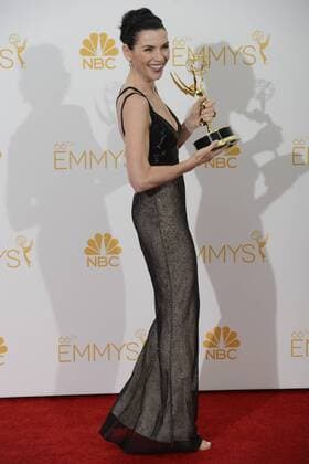 Julianna Margulies, winner of Outstanding Lead Actress In A Drama Series for The Good Wife appears backstage at the Primetime Emmy Awards at the Nokia Theatre in Los Angeles on August 25, 2014.  LAP20140825185