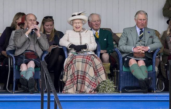 Queen Elizabeth II., accompanied by Prince Charles and the Duke of Edinburgh, Prince Philipp attend the annual Braemar Highland Gathering. . 06 09 2014. Braemar, United Kingdom. Braemar Highland Gathering. Braemar.  xi-Imagesx IIM-2917-0013