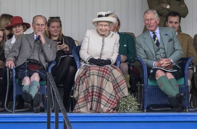 Queen Elizabeth II., accompanied by Prince Charles and the Duke of Edinburgh, Prince Philipp attend the annual Braemar Highland Gathering. . 06 09 2014. Braemar, United Kingdom. Braemar Highland Gathering. Braemar.  xi-Imagesx IIM-2917-0017