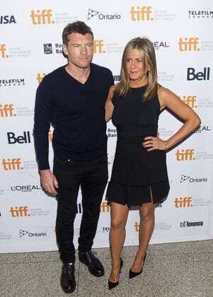 Actor Sam Worthington (L) and actress Jennifer Aniston pose for photos before the premiere of the film Cake at Elgin Theatre during the 39th Toronto International Film Festival in Toronto, Canada, Sept. 8, 2014. ) CANADA-TORONTO-INTERNATIONAL FILM FESTIVAL-FILM FOXCATCHER ZouxZheng 