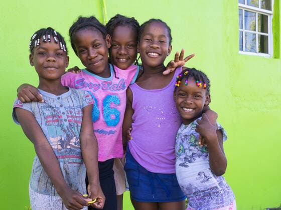 Caribbean, St. Lucia, Soufriere, Smiling girls outdoors  AM001818