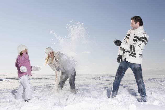 Germany, Bavaria, Munich, Family having snowball fight model released  RBF00076